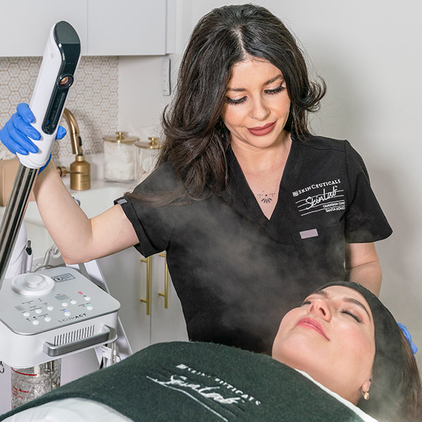 a woman getting facial treatment