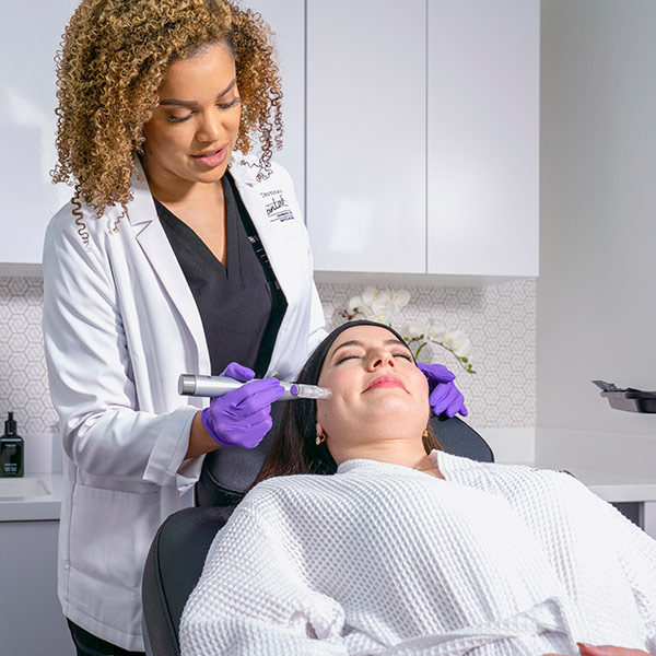 a woman getting facial treatment